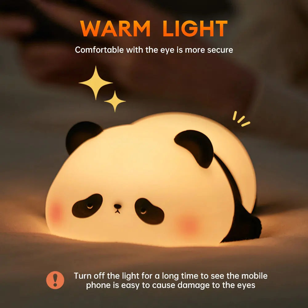 Cute panda-shaped night light with warm glow on a dark background
